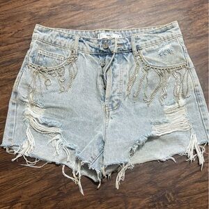 Blue jean shorts with tassels